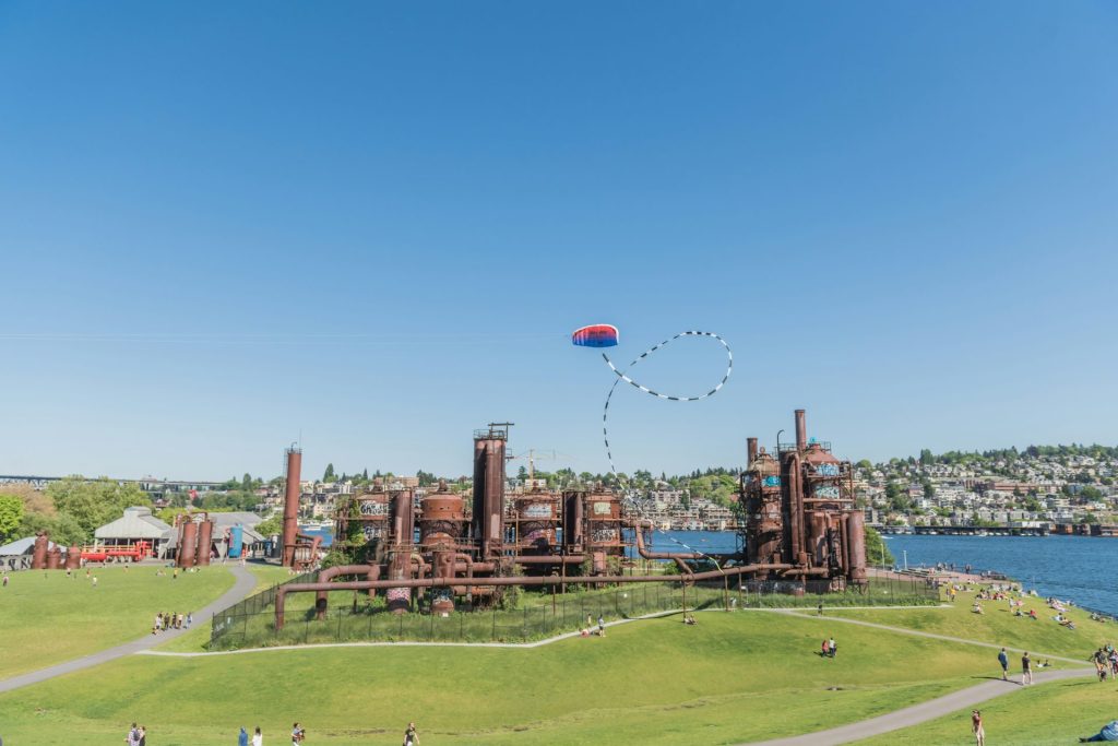 People enjoying a park with old machinery