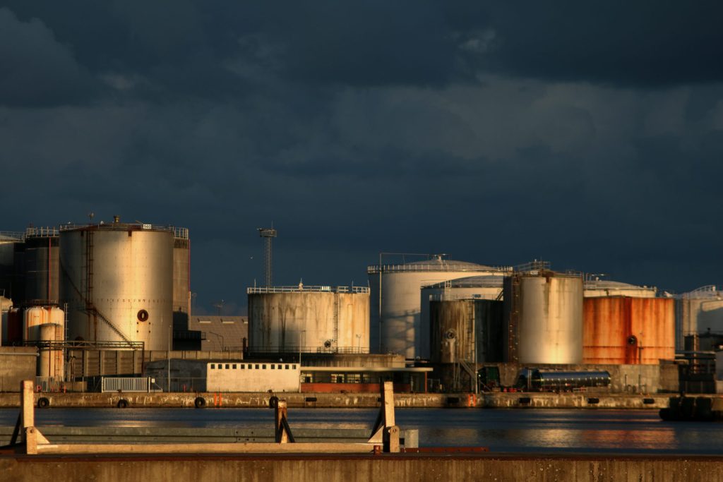 Large industrial storage tanks by the water